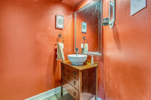 a view of a room with rack and wooden floor
