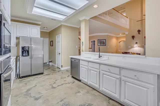 a spacious bathroom with double sink and a mirror