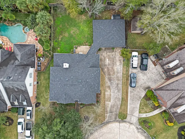 an aerial view of a house with outdoor space