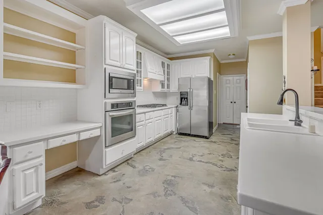a kitchen with stainless steel appliances cabinets and a sink