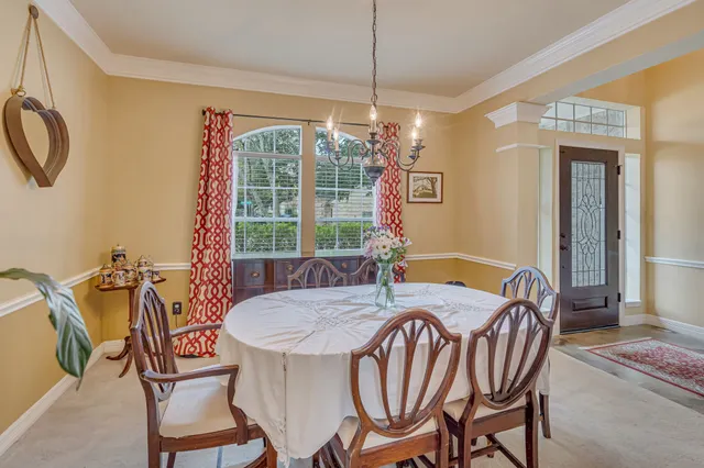 a view of a dining room with furniture window and outside view