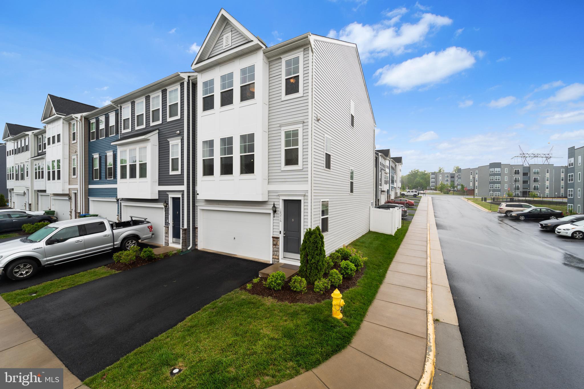 a view of a white car parked in front of a building