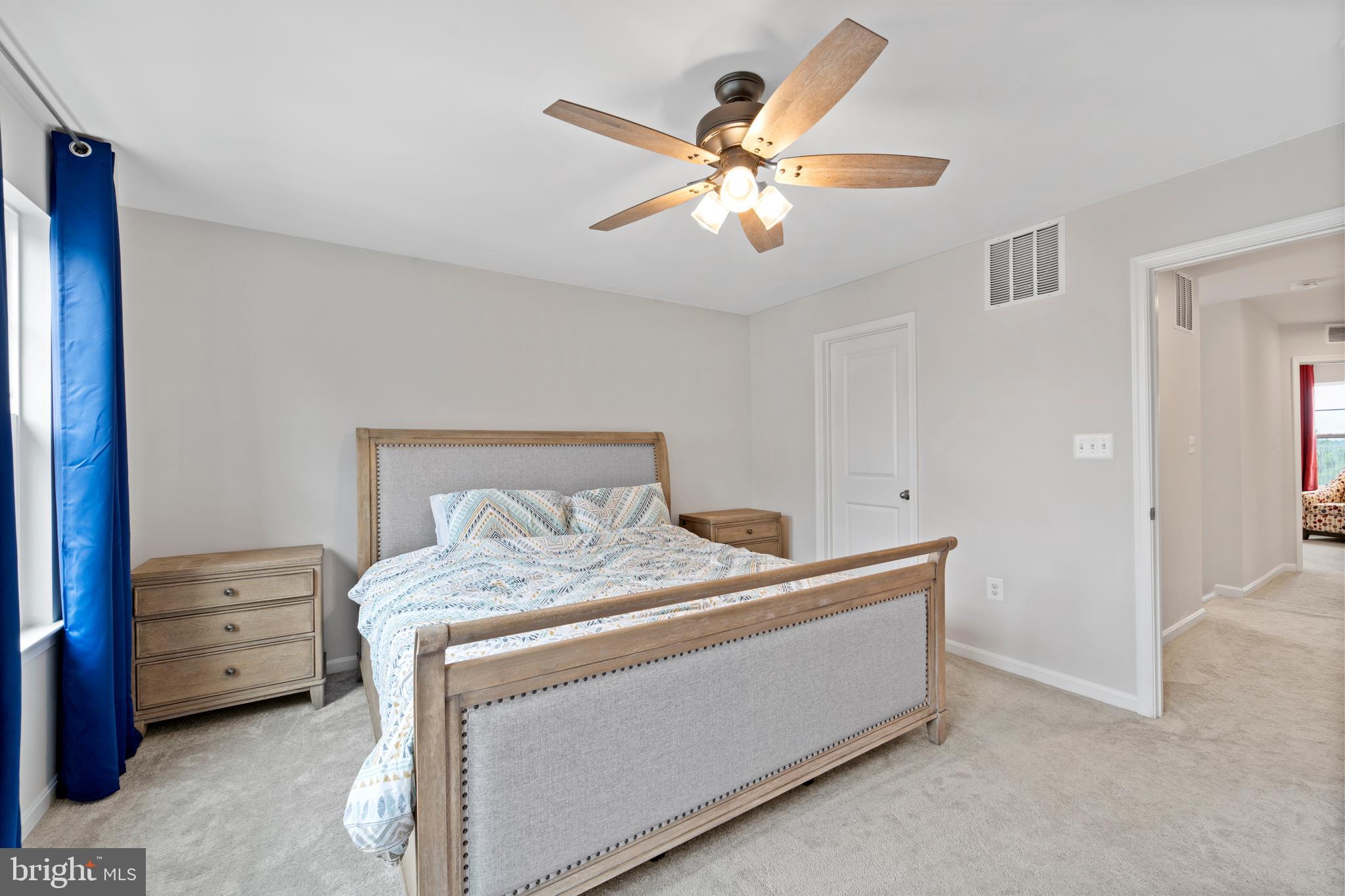 18216 Summit Pointe Drive Triangle, VA 22172 - Photo 13 of 25 a bedroom with a bed and a chandelier