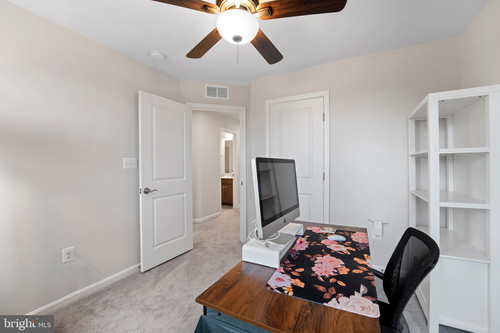 18216 Summit Pointe Drive Triangle, VA 22172 - Photo 16 of 25 a living room with furniture and a flat screen tv