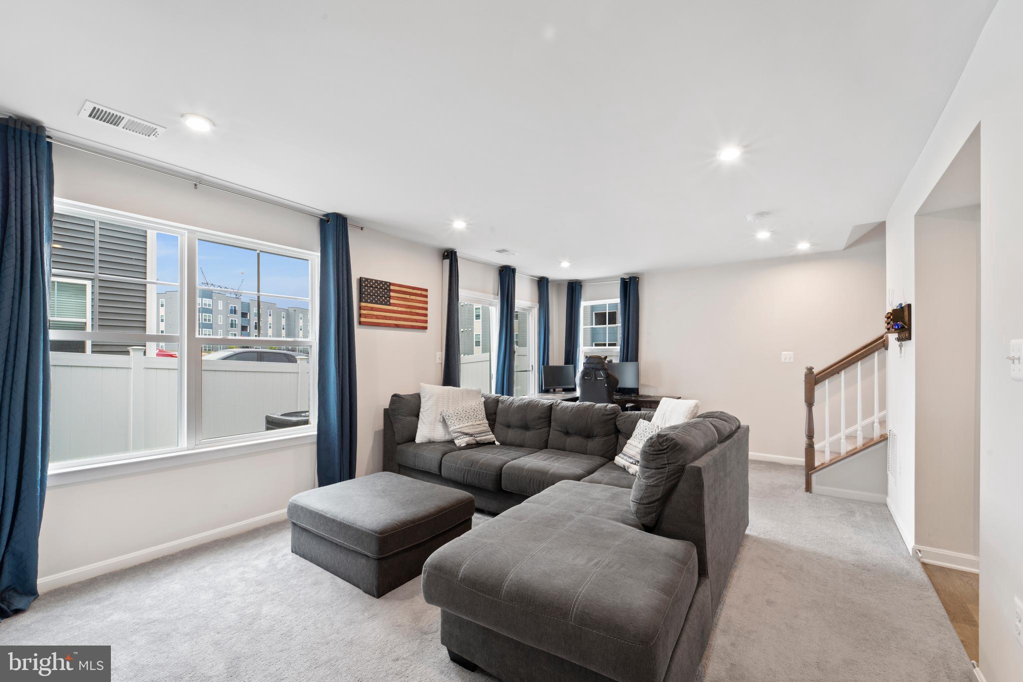 18216 Summit Pointe Drive Triangle, VA 22172 - Photo 22 of 25 a living room with furniture and large windows