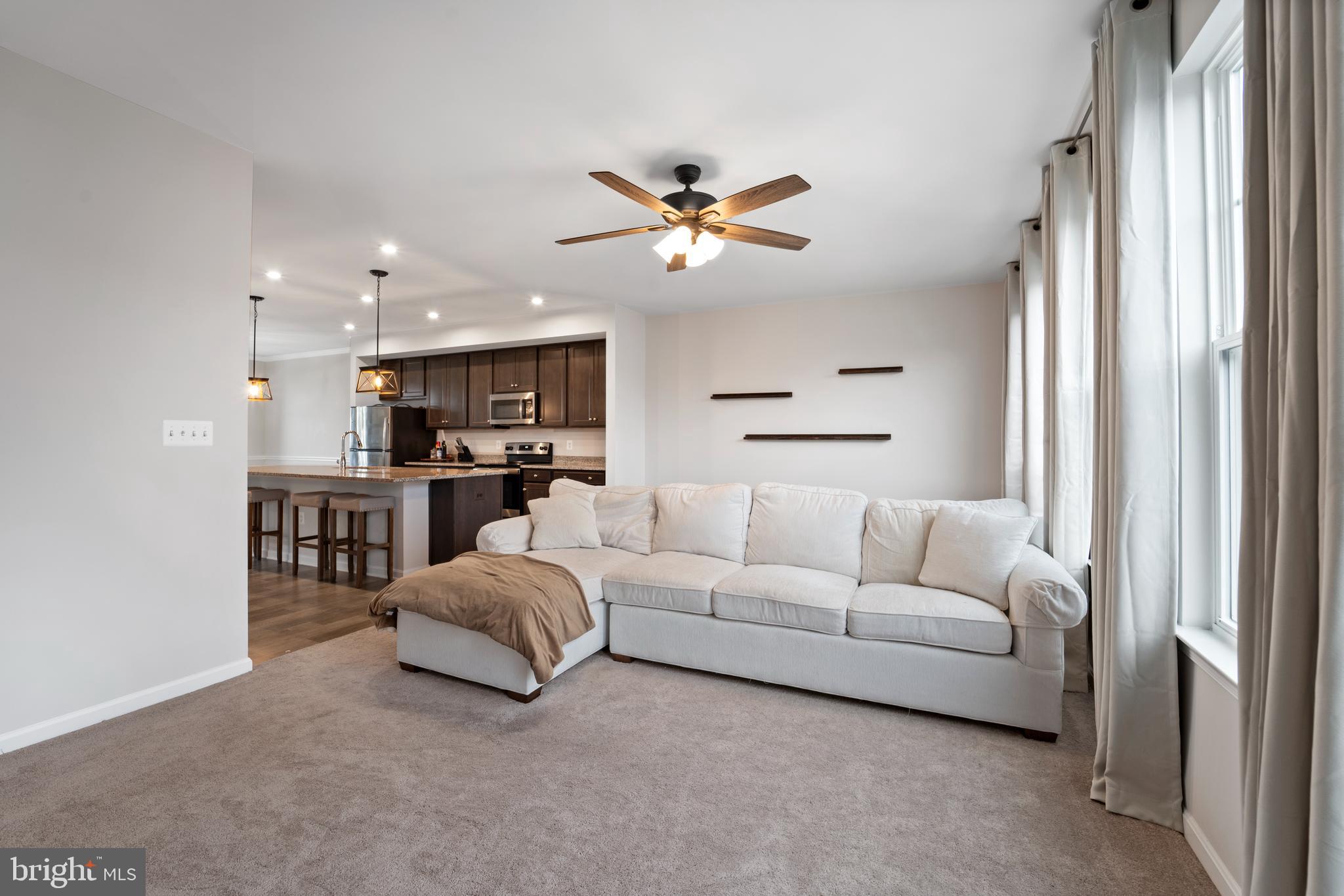 18216 Summit Pointe Drive Triangle, VA 22172 - Photo 9 of 25 a living room with furniture and kitchen view