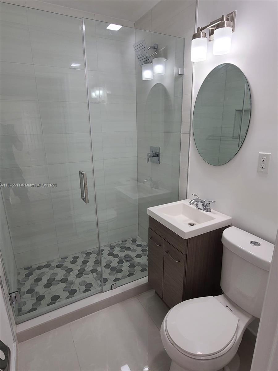 2180 Southwest 20th Street Miami, FL 33145 - Photo 11 of 31 a bathroom with a sink toilet and shower