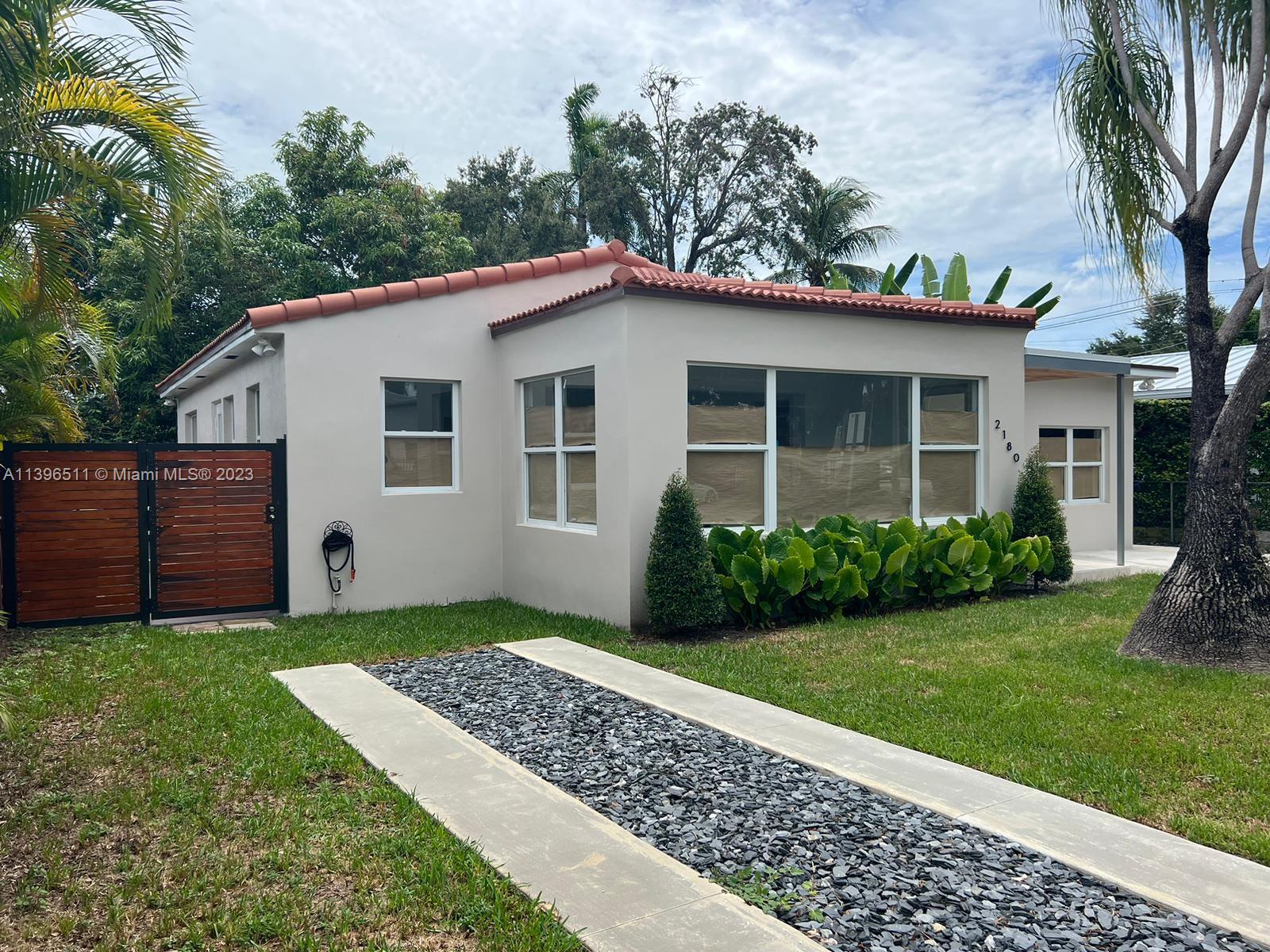 2180 Southwest 20th Street Miami, FL 33145 - Photo 16 of 31 a view of a house with a yard