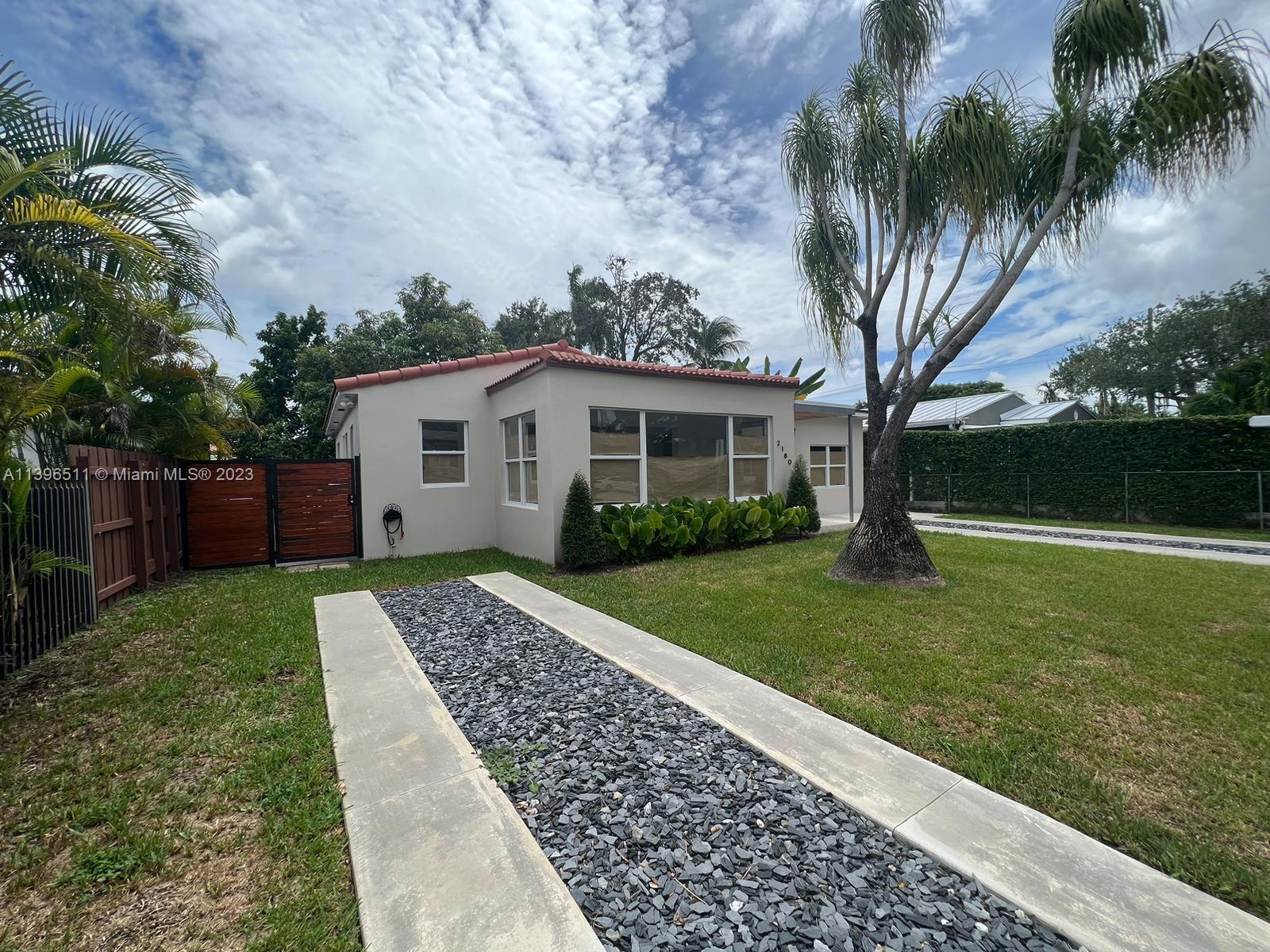2180 Southwest 20th Street Miami, FL 33145 - Photo 17 of 31 a view of a house with a yard