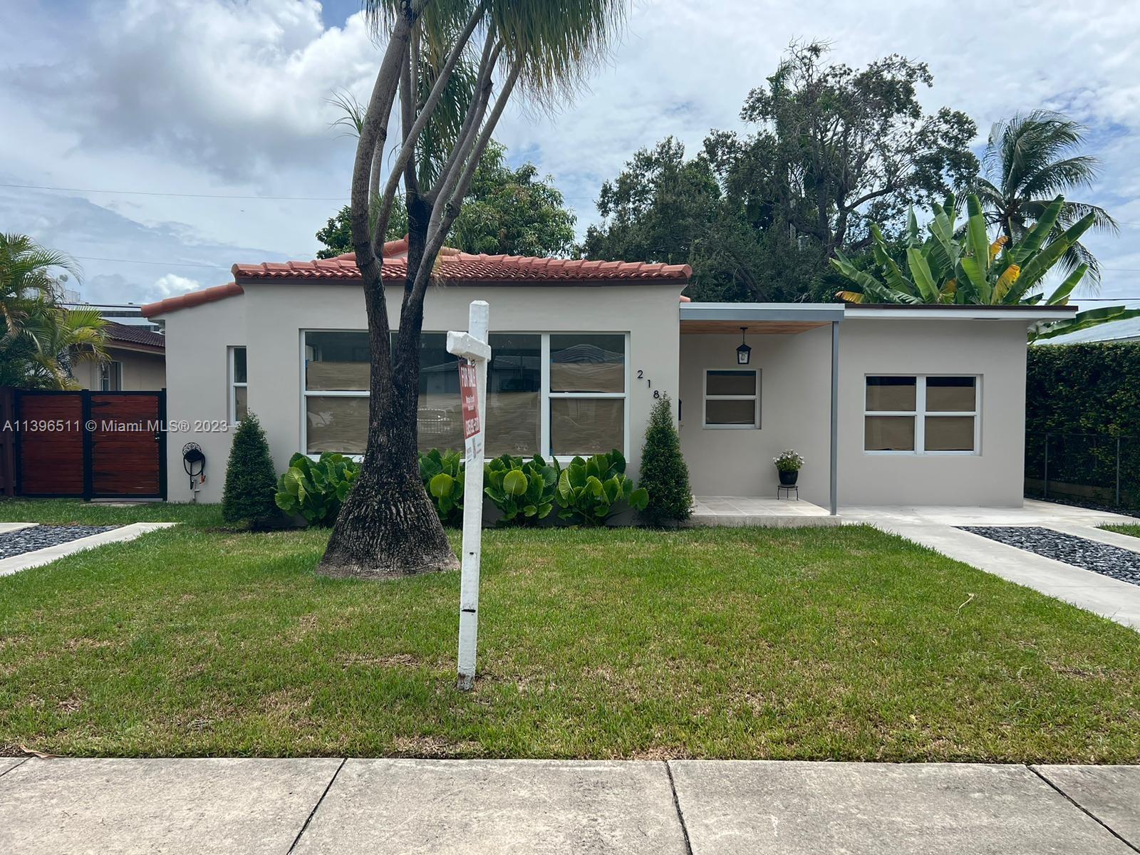 2180 Southwest 20th Street Miami, FL 33145 - Photo 21 of 31 a front view of house with a garden