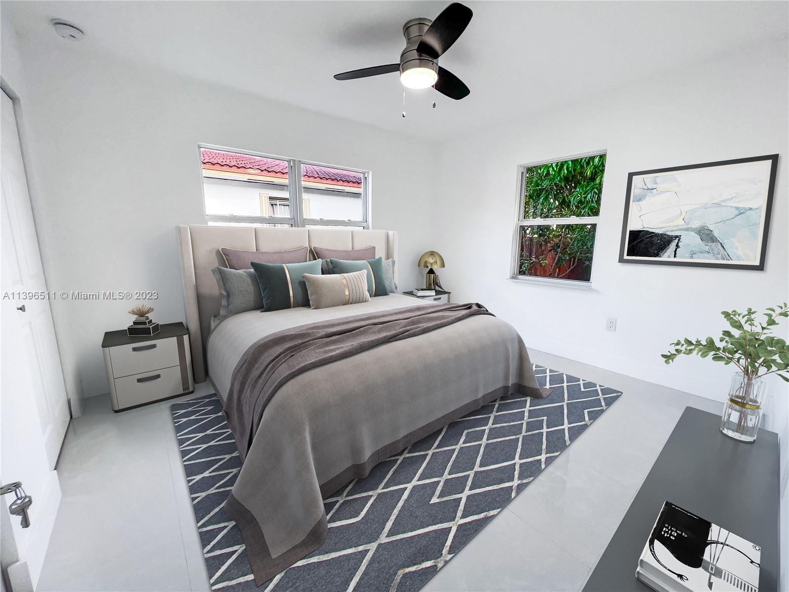 2180 Southwest 20th Street Miami, FL 33145 - Photo 22 of 31 a bedroom with a bed and a potted plant