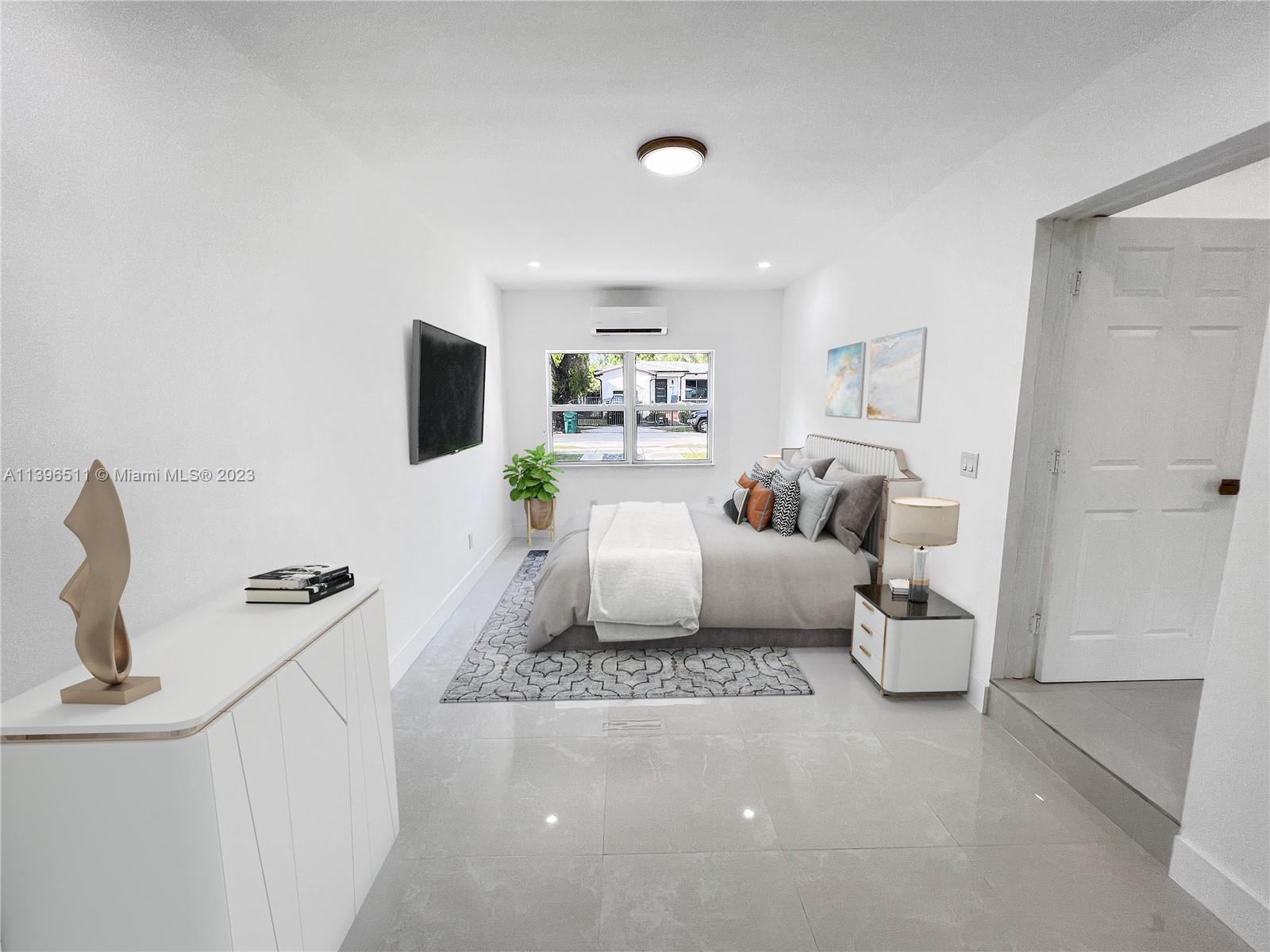 2180 Southwest 20th Street Miami, FL 33145 - Photo 23 of 31 a living room with furniture and a flat screen tv