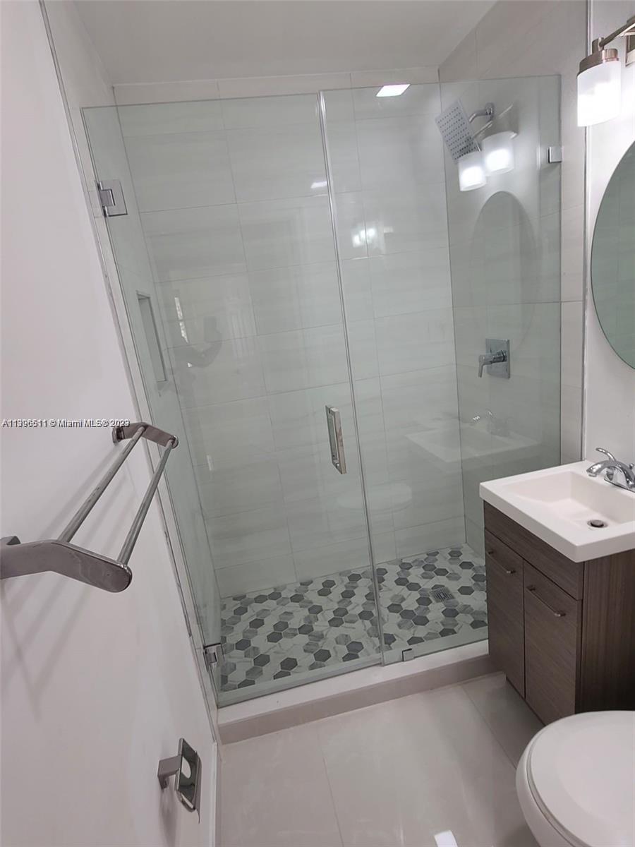 2180 Southwest 20th Street Miami, FL 33145 - Photo 25 of 31 a bathroom with a sink a toilet and shower
