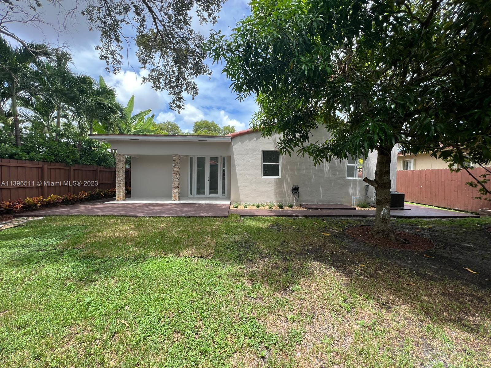 2180 Southwest 20th Street Miami, FL 33145 - Photo 28 of 31 a view of a house with backyard and sitting area