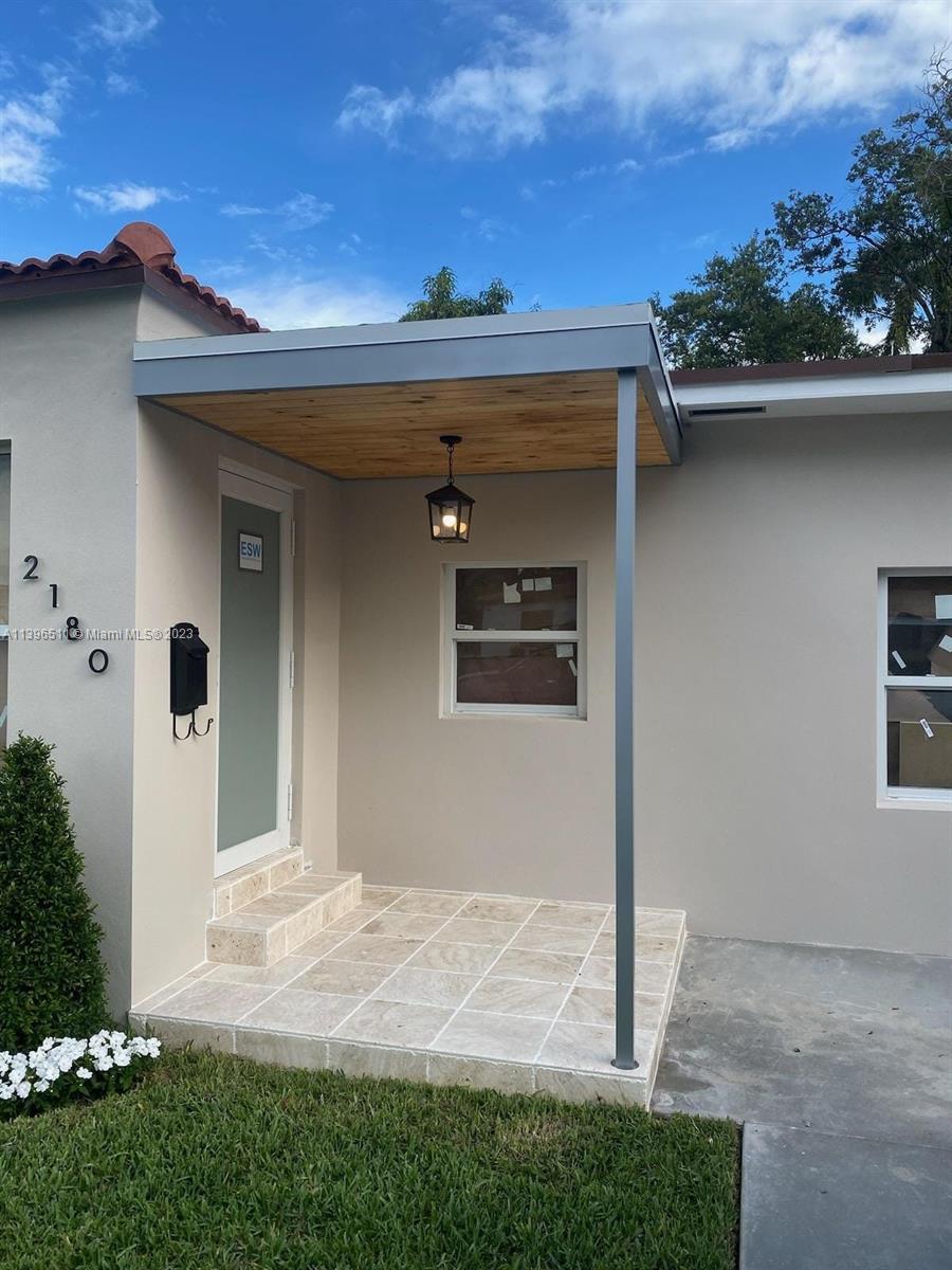 2180 Southwest 20th Street Miami, FL 33145 - Photo 3 of 31 front view of a house with a yard