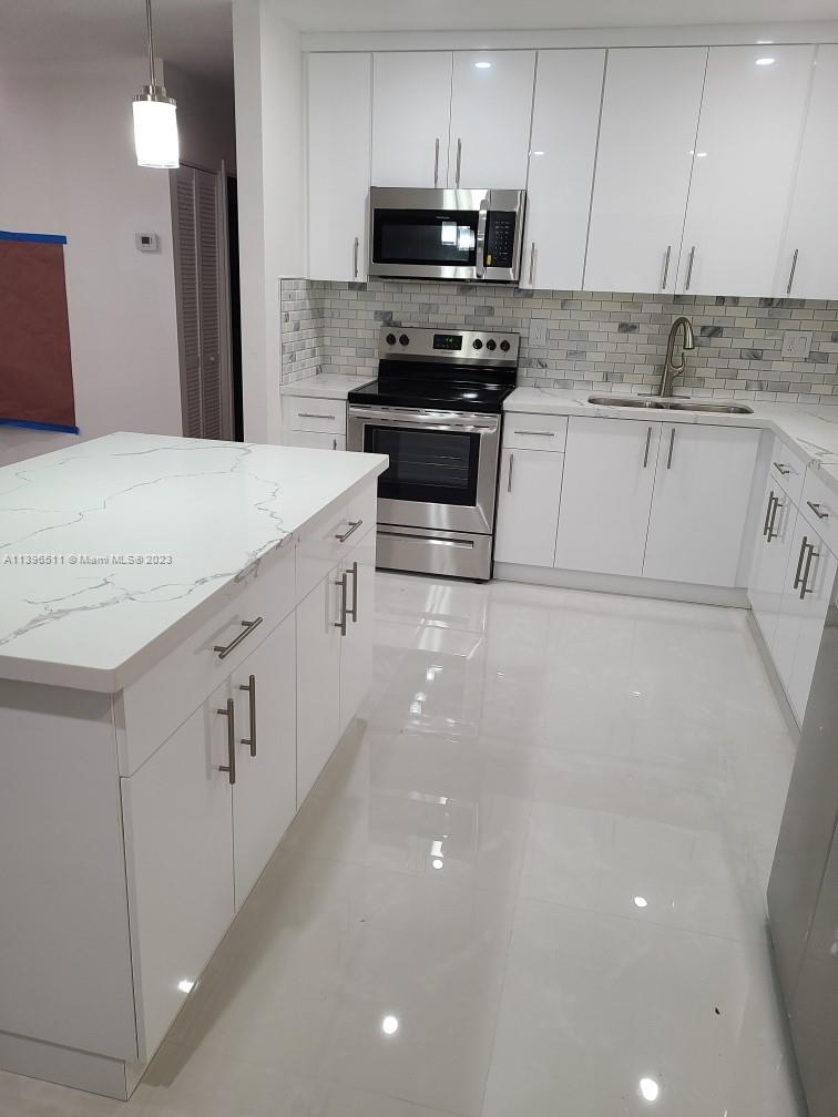 2180 Southwest 20th Street Miami, FL 33145 - Photo 4 of 31 a view of a kitchen with electric appliances