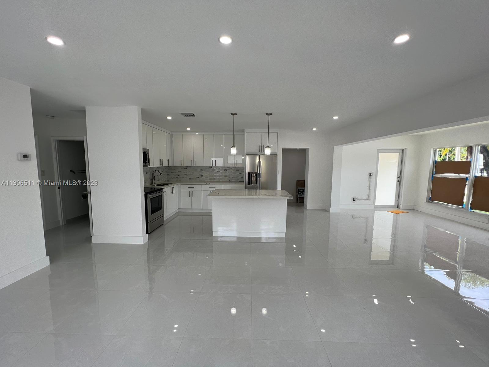 2180 Southwest 20th Street Miami, FL 33145 - Photo 10 of 31 a view of a kitchen with refrigerator and windows