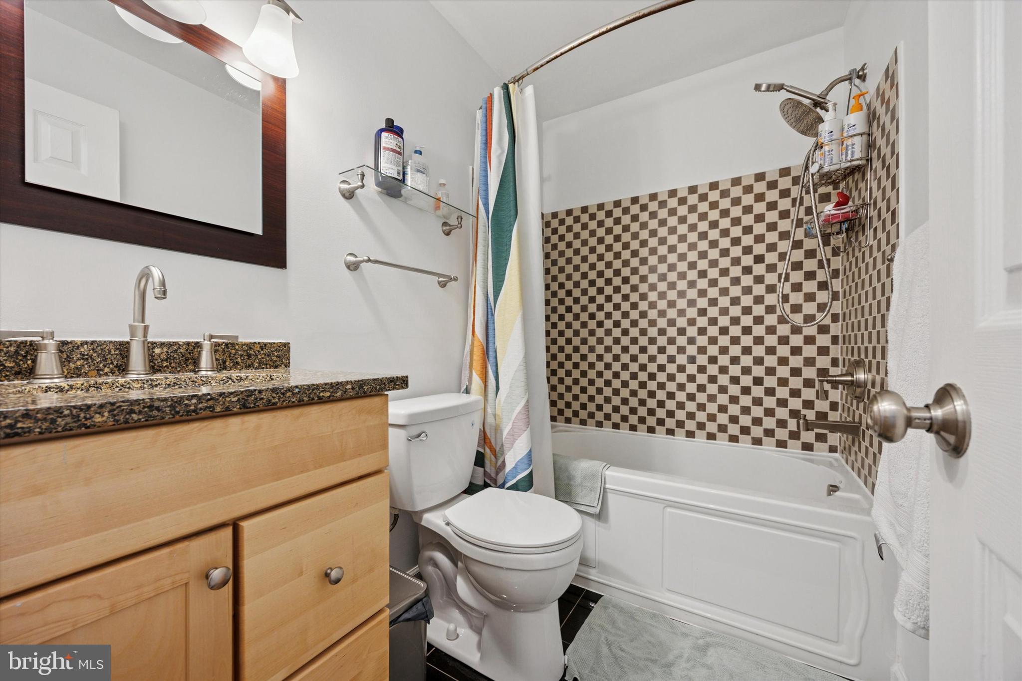 814 South Sheridan Street, Unit 2E Philadelphia, PA 19147 - Photo 12 of 24 a bathroom with a sink toilet and shower