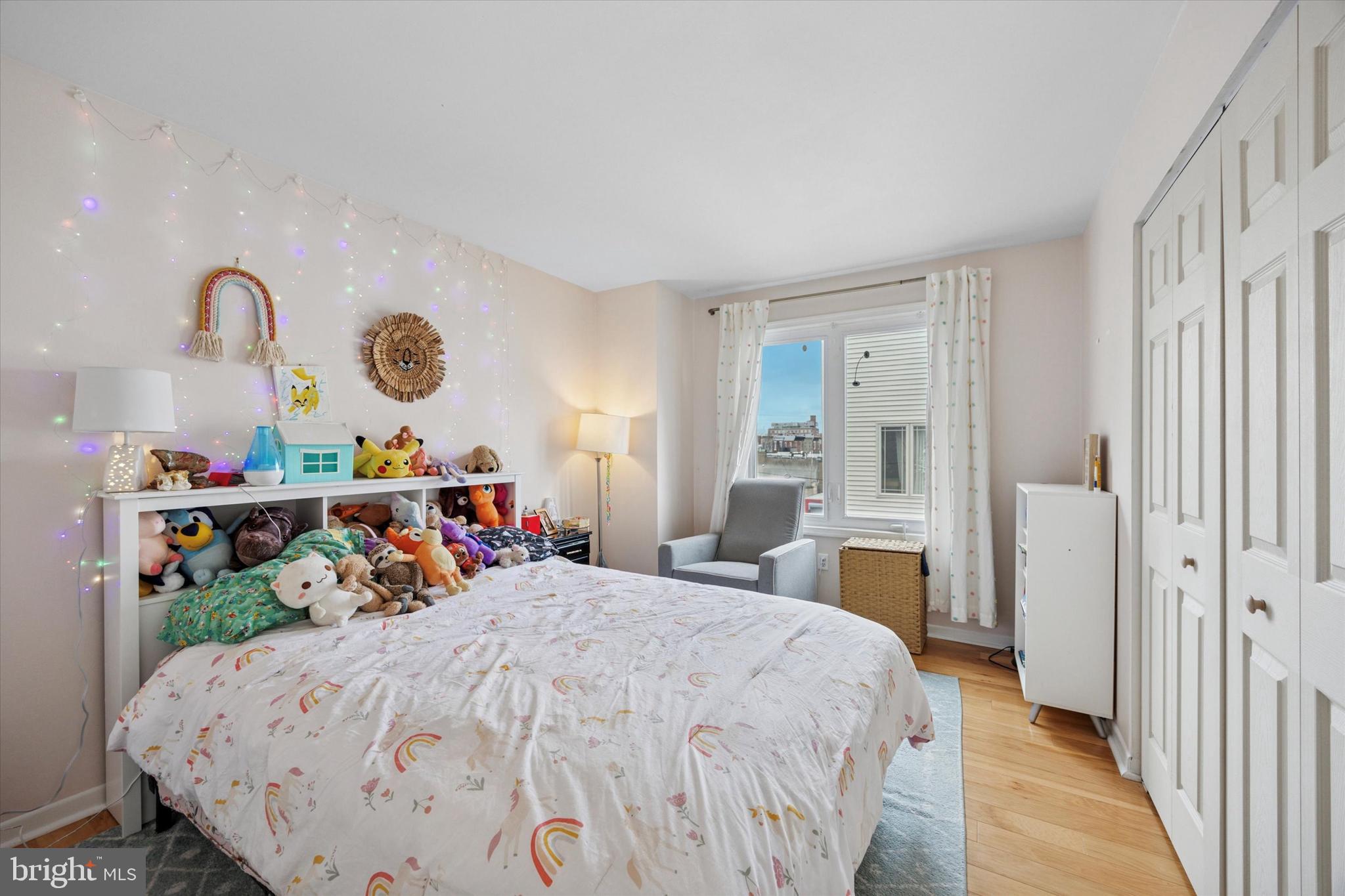 814 South Sheridan Street, Unit 2E Philadelphia, PA 19147 - Photo 13 of 24 a bed room with a bed and a chair