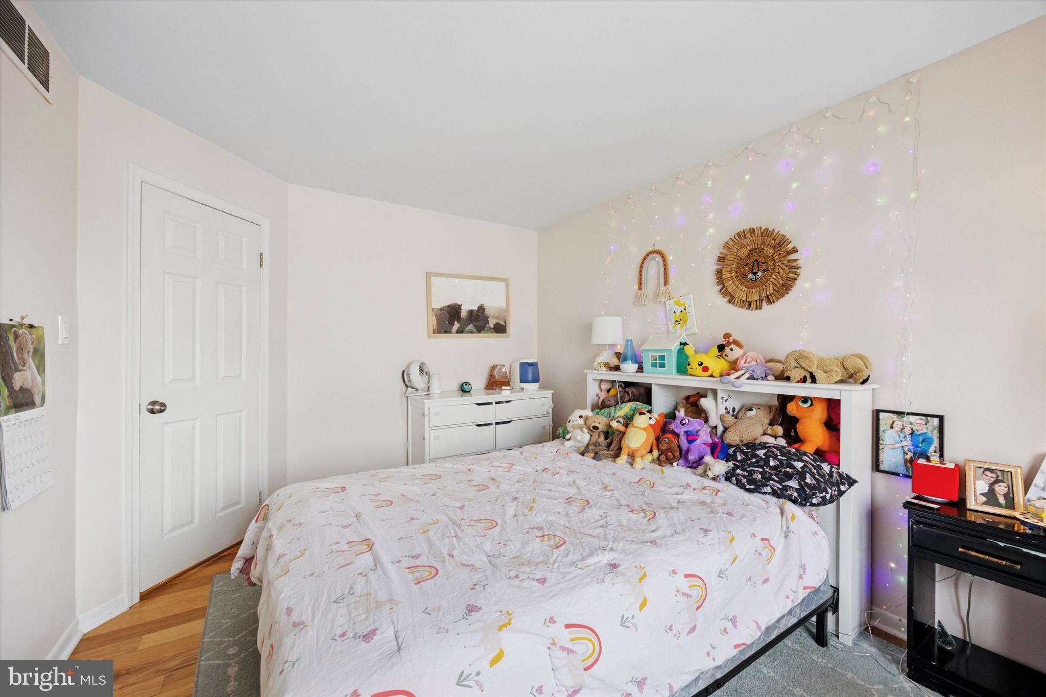 814 South Sheridan Street, Unit 2E Philadelphia, PA 19147 - Photo 14 of 24 a bedroom with a bed and a dresser