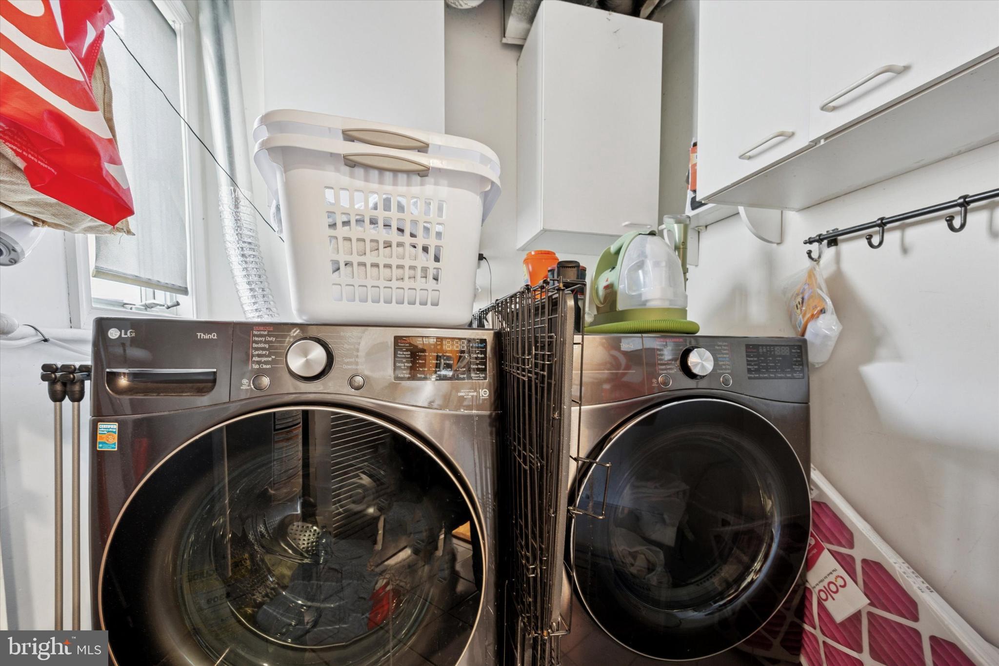 814 South Sheridan Street, Unit 2E Philadelphia, PA 19147 - Photo 22 of 24 a utility room with dryer and washer