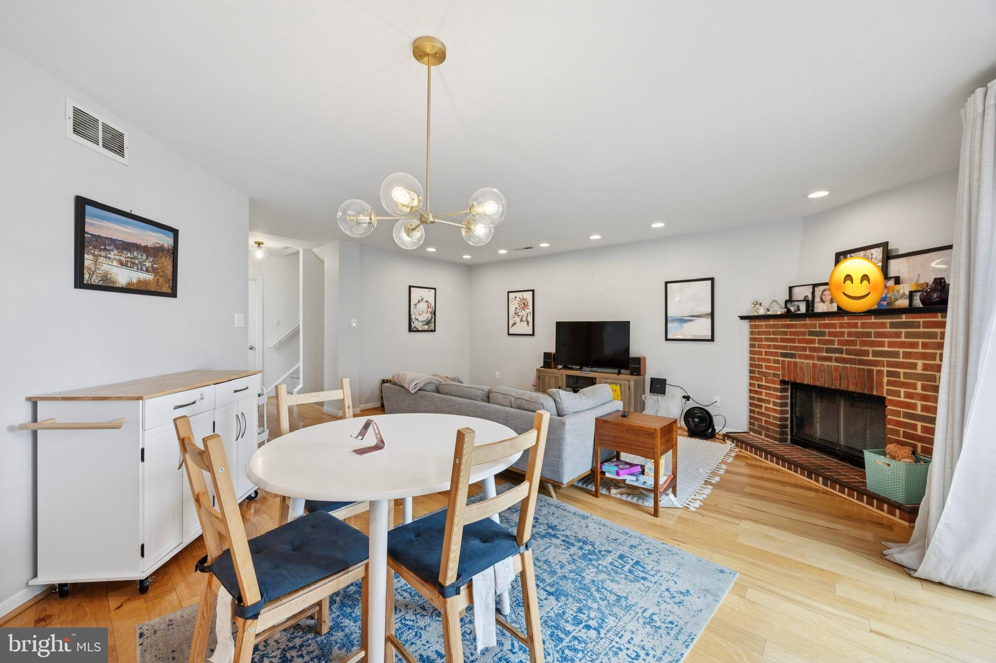 814 South Sheridan Street, Unit 2E Philadelphia, PA 19147 - Photo 7 of 24 a view of a dining room and a livingroom with furniture wooden floor a chandelier