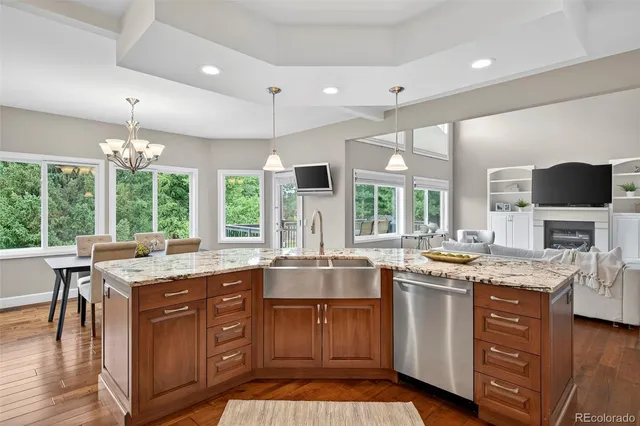 a kitchen with a sink stove and cabinets