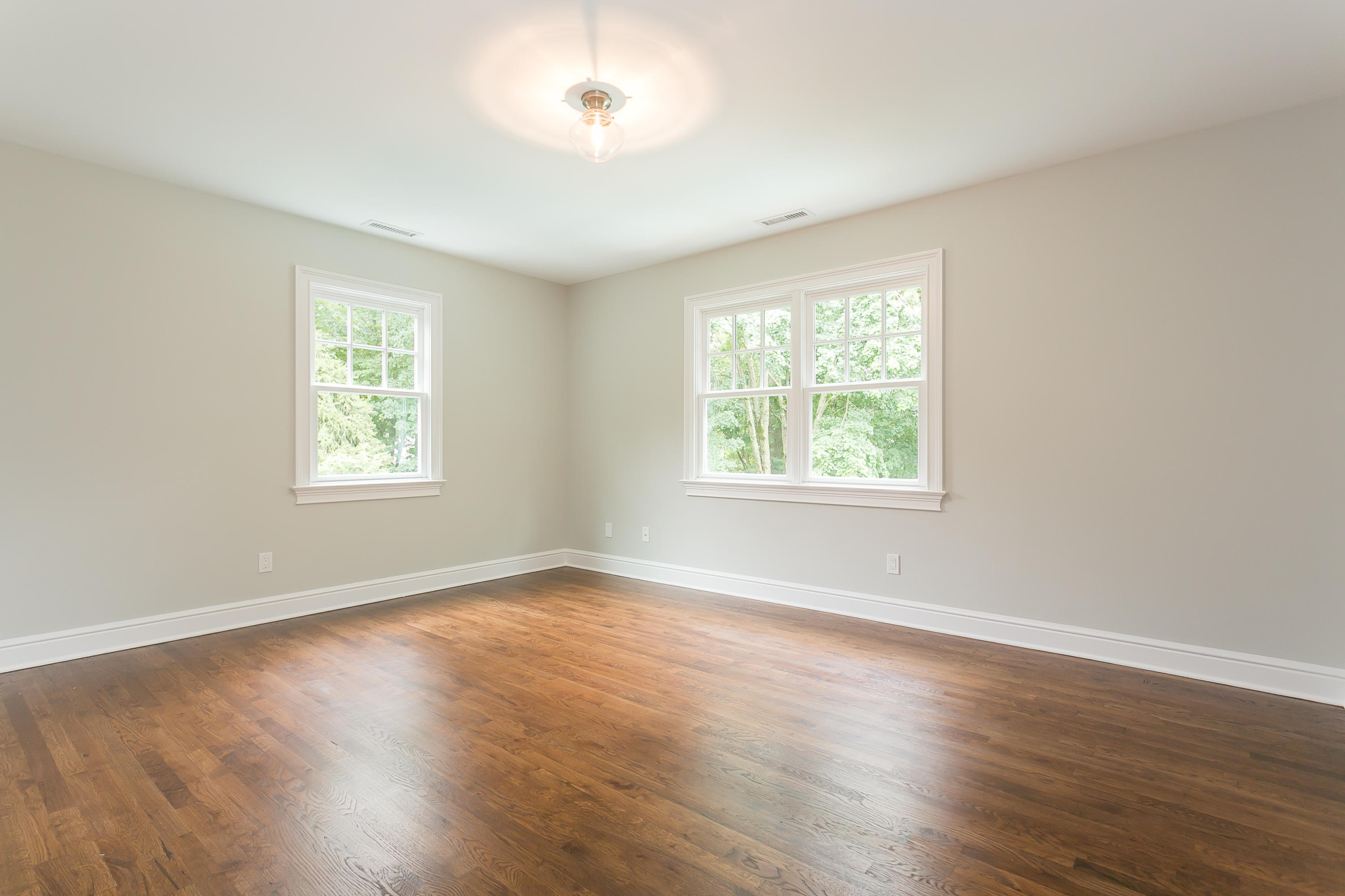 26 Country Club Road Darien, CT 06820 - Photo 27 of 42 a view of an empty room with wooden floor and a window