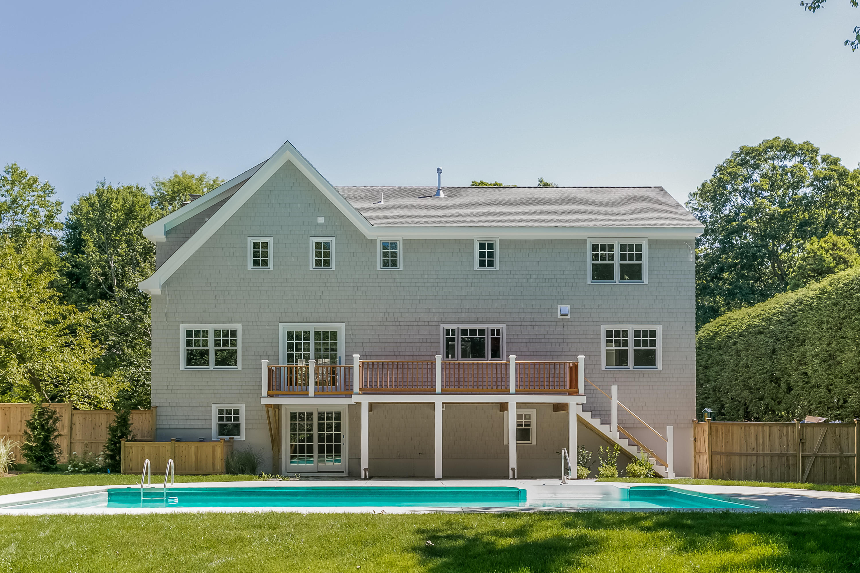 26 Country Club Road Darien, CT 06820 - Photo 3 of 42 a front view of a house with a yard