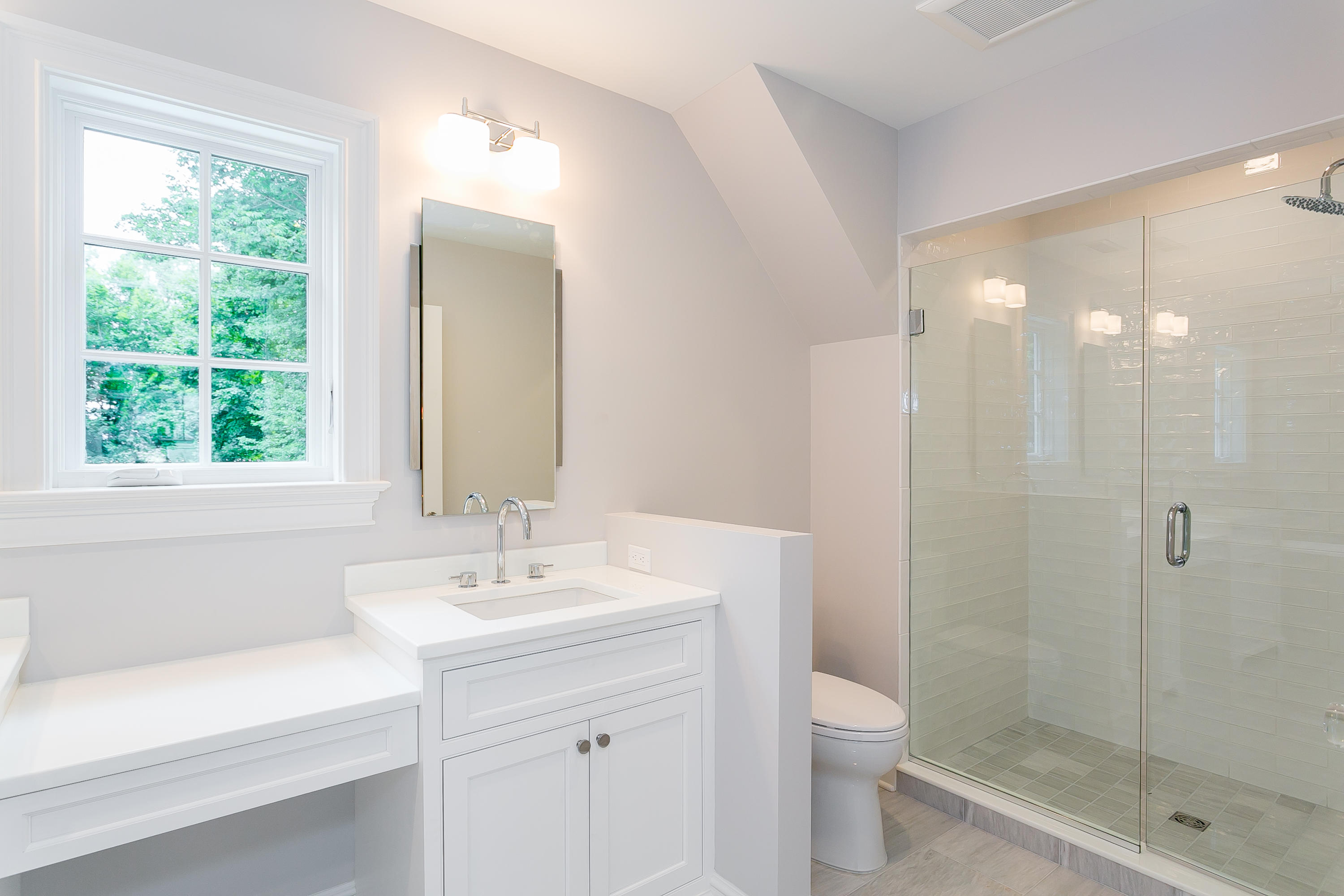 26 Country Club Road Darien, CT 06820 - Photo 33 of 42 a bathroom with a bathtub shower sink vanity and toilet