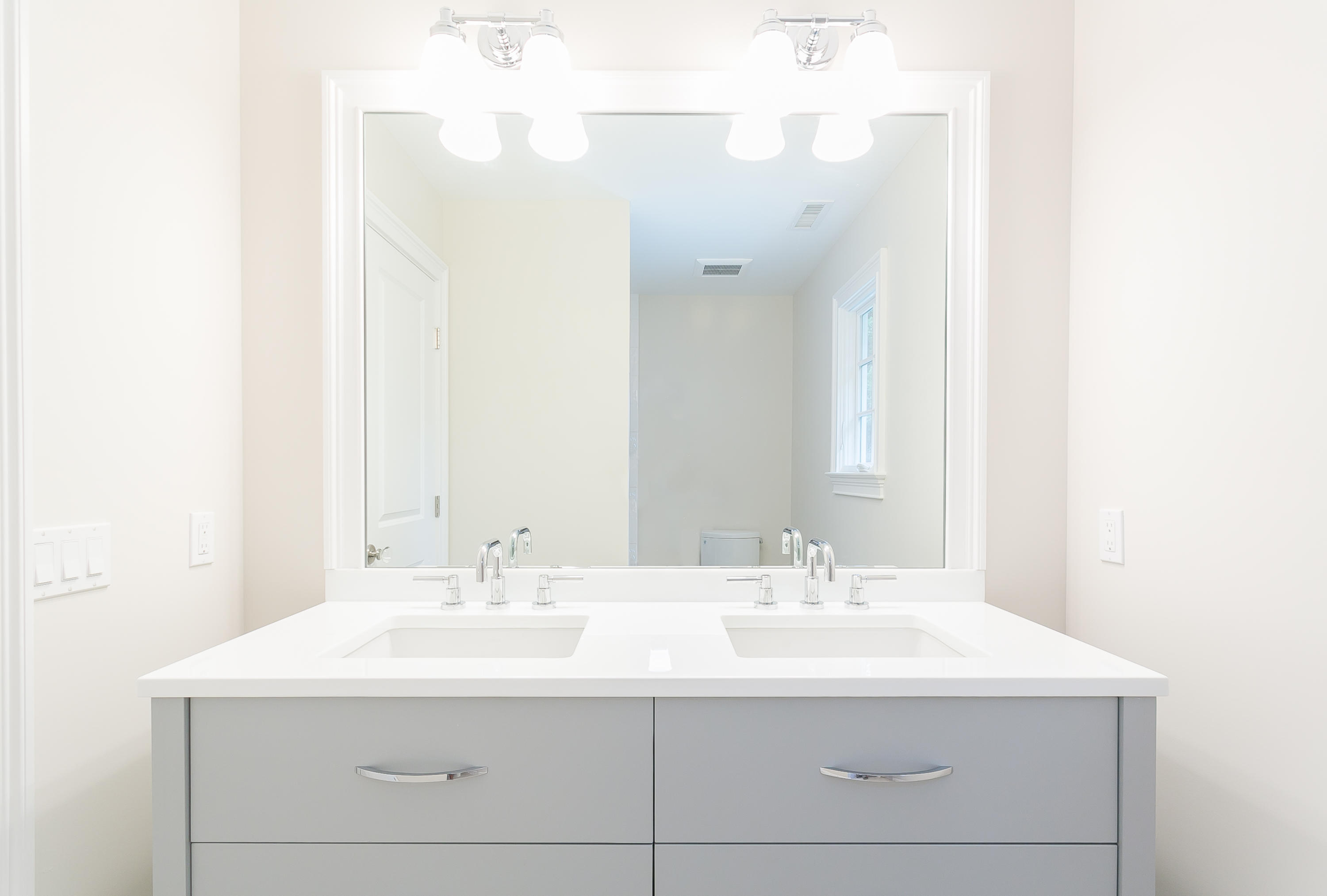 26 Country Club Road Darien, CT 06820 - Photo 40 of 42 a bathroom with a sink and a mirror