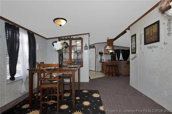 a view of a livingroom with furniture and window