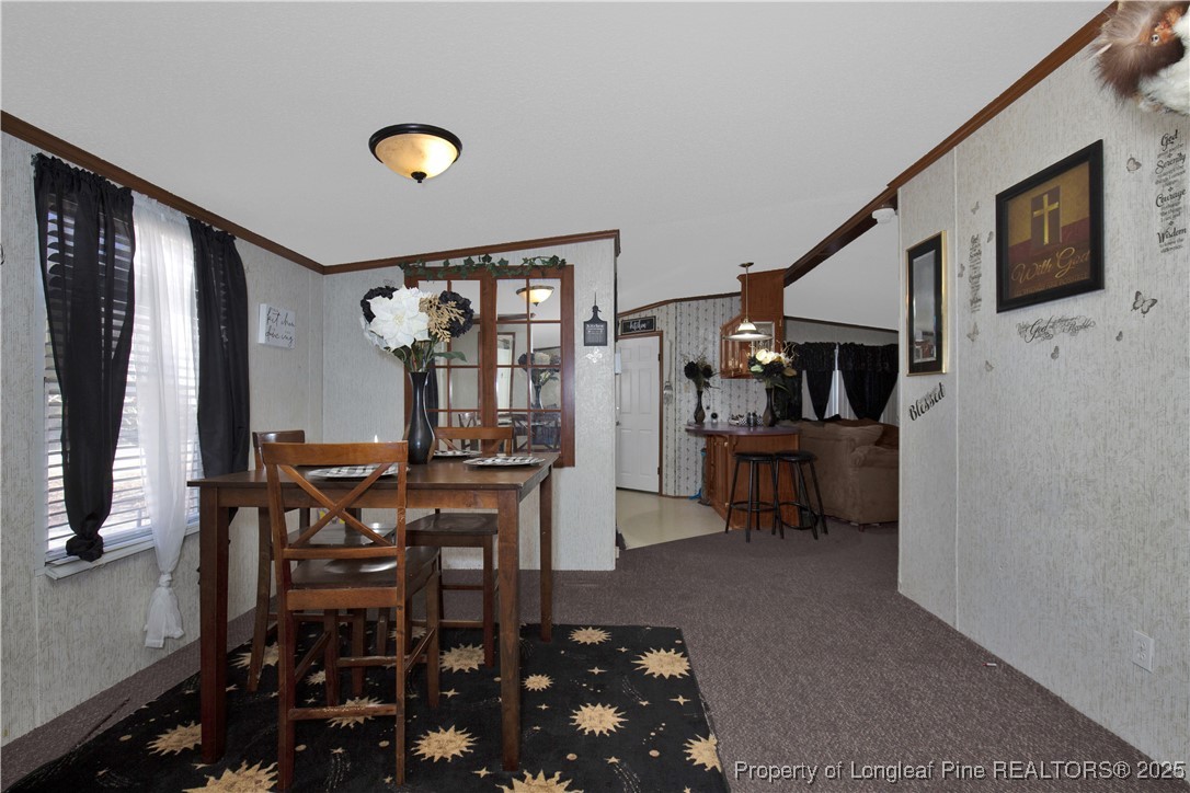 5065 Tobacco Road Orrum, NC 28369 - Photo 13 of 31 a view of a livingroom with furniture and window