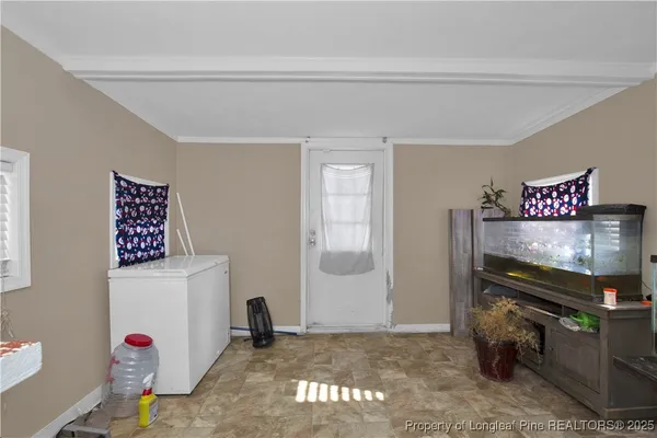 a view of an empty room with stairs and toys