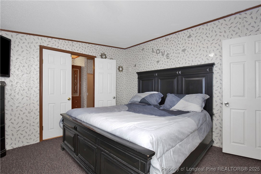5065 Tobacco Road Orrum, NC 28369 - Photo 18 of 31 a bedroom with a bed and a dresser