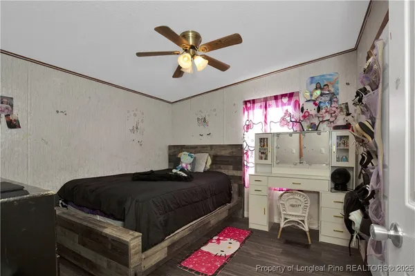 a bedroom with furniture and a chandelier