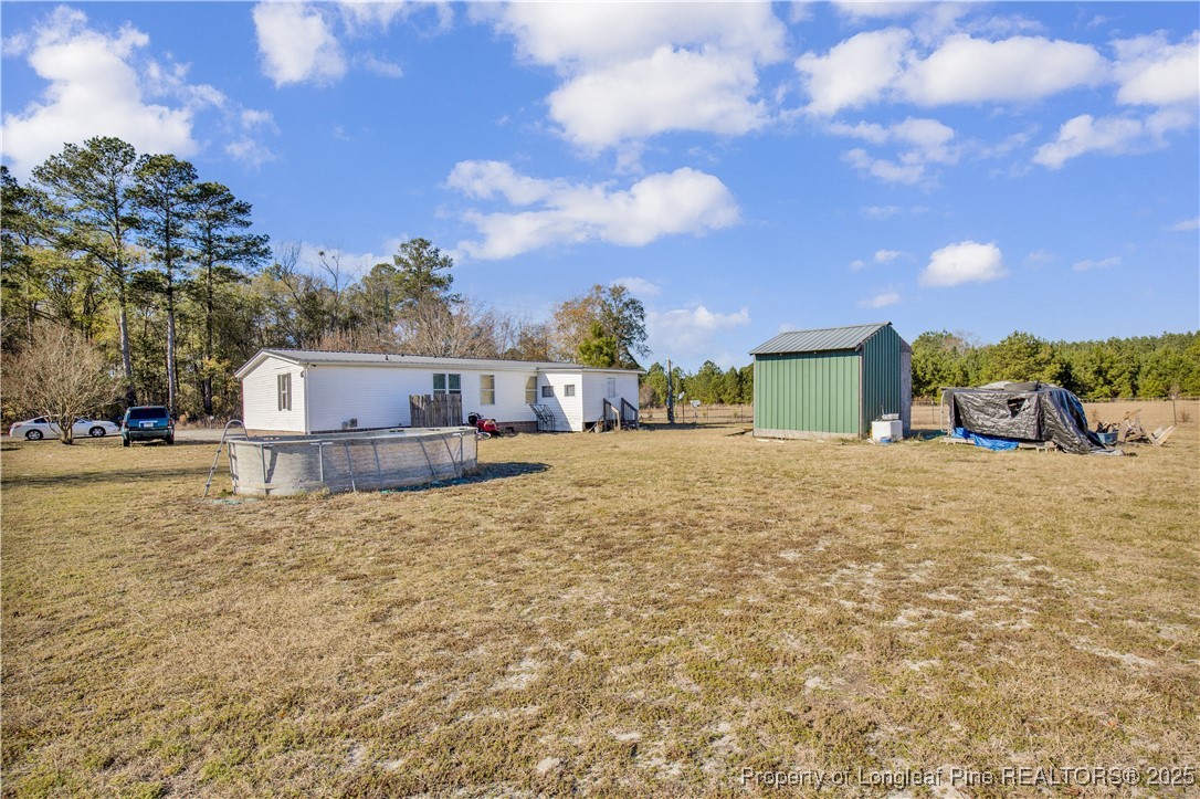 5065 Tobacco Road Orrum, NC 28369 - Photo 27 of 31 a view of a house with a yard