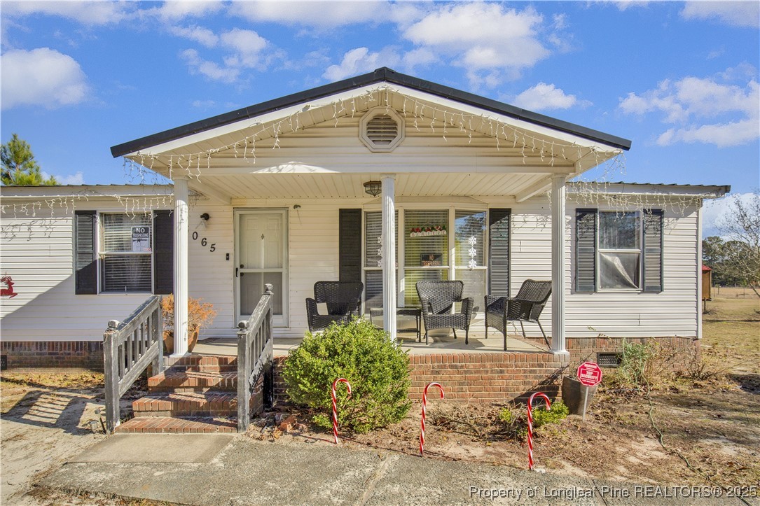 5065 Tobacco Road Orrum, NC 28369 - Photo 4 of 31 a front view of a house with garden