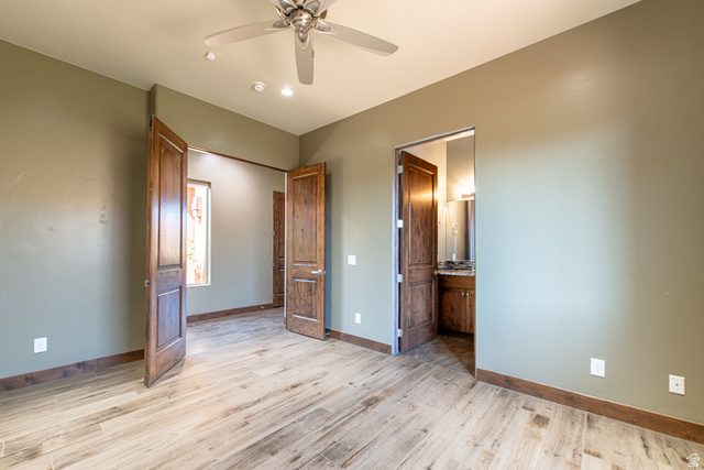 322 340 E Street Ivins, UT 84738 - Photo 35 of 61 Spacious room featuring wood-finish flooring, warm olive walls, and a recessed window