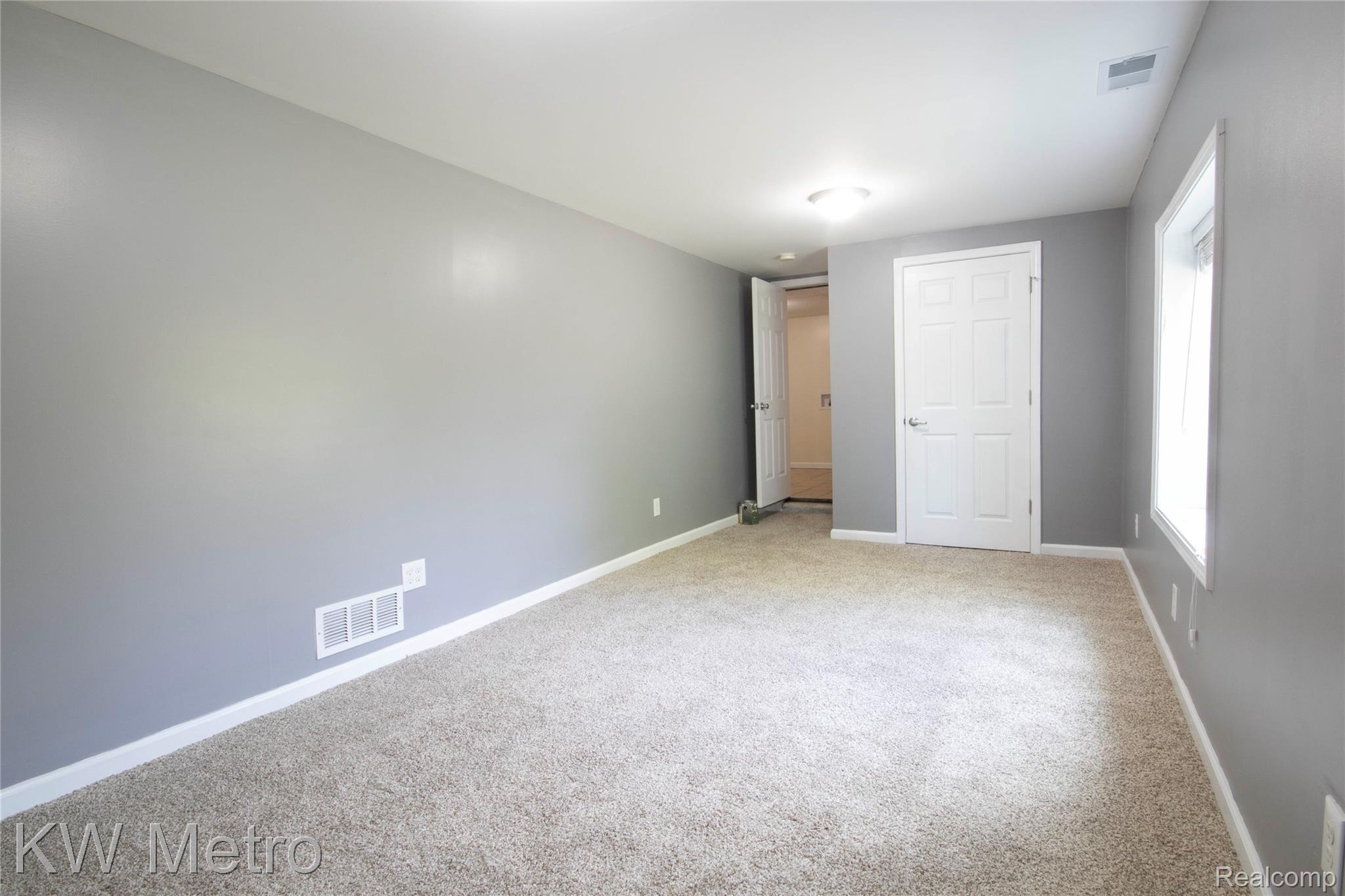 10800 Holland Road Taylor, MI 48180 - Photo 13 of 16 Unfurnished bedroom with baseboards and carpet