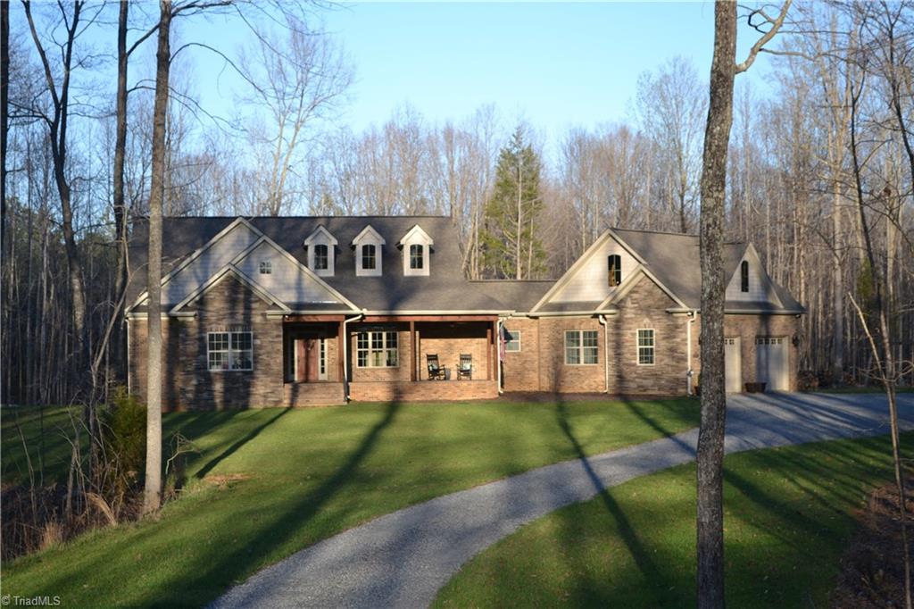 6836 High Rock Road Browns Summit, NC 27214 - Photo 1 of 21 Beautiful custom home with long private drive. Check out that beautiful yard!