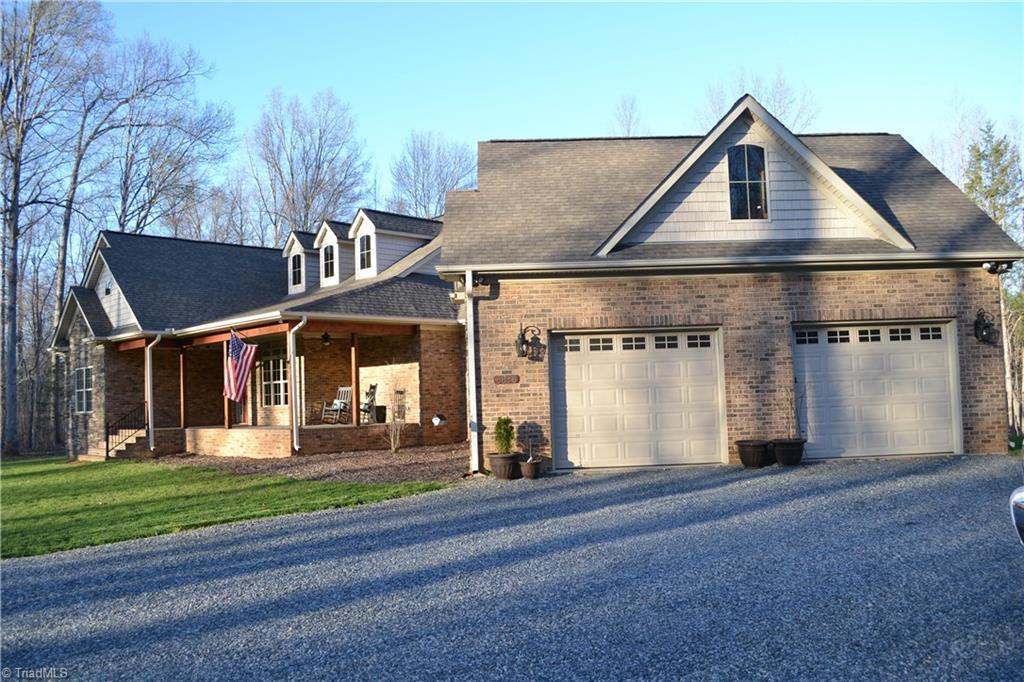 6836 High Rock Road Browns Summit, NC 27214 - Photo 4 of 21 Nice side garage with door openers and separate entry on the back.