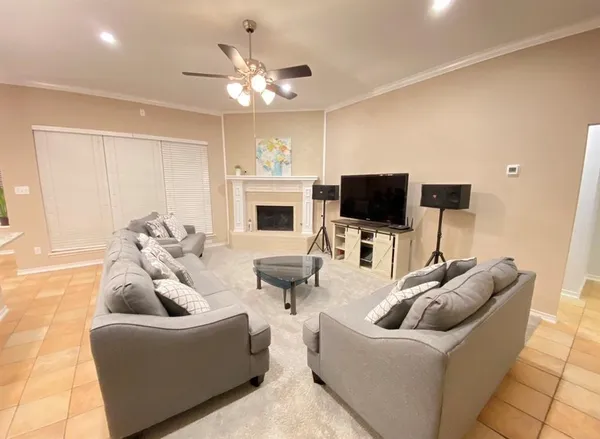 a living room with furniture and a flat screen tv