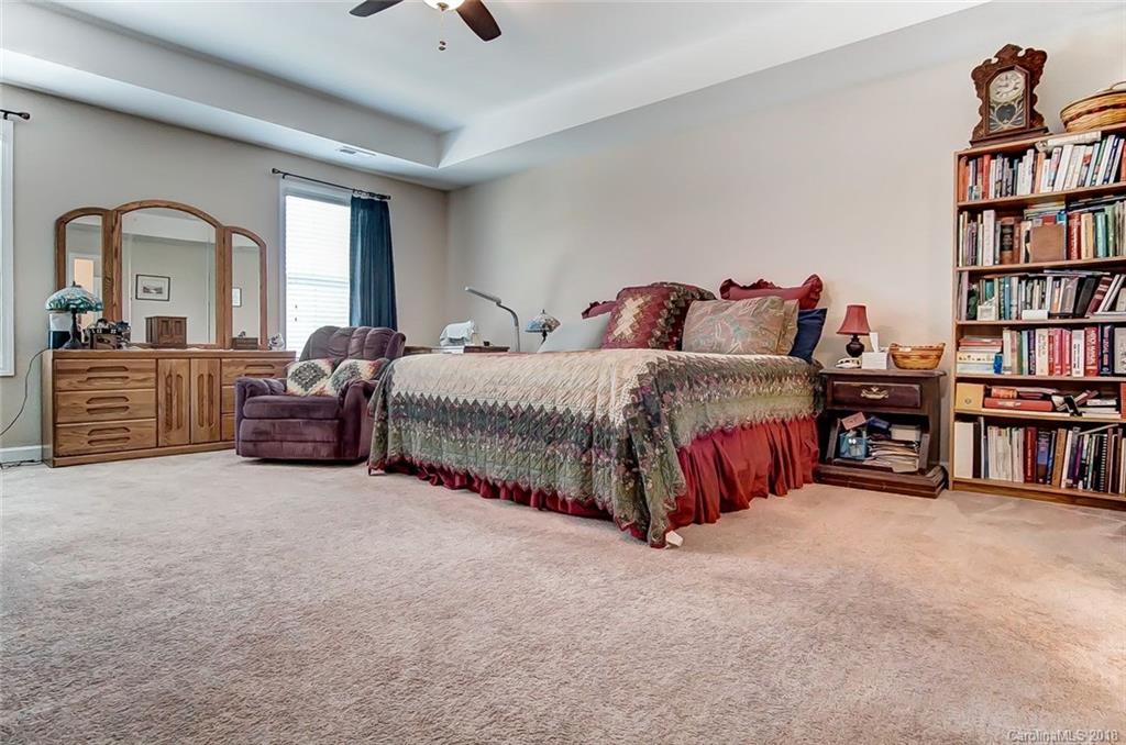 79073 Ridgehaven Road Lancaster, SC 29720 - Photo 22 of 36 a spacious bedroom with a bed and a large window