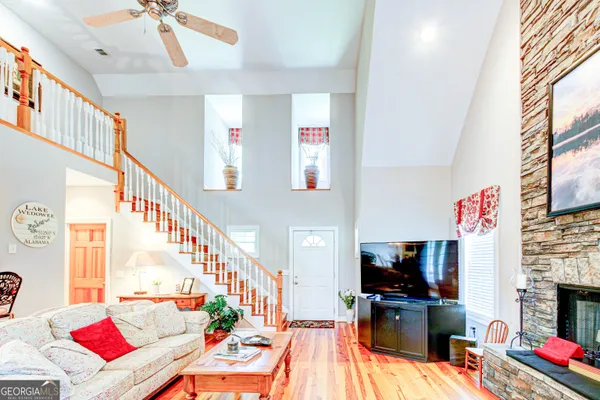 a kitchen with stainless steel appliances kitchen island granite countertop a refrigerator and microwave