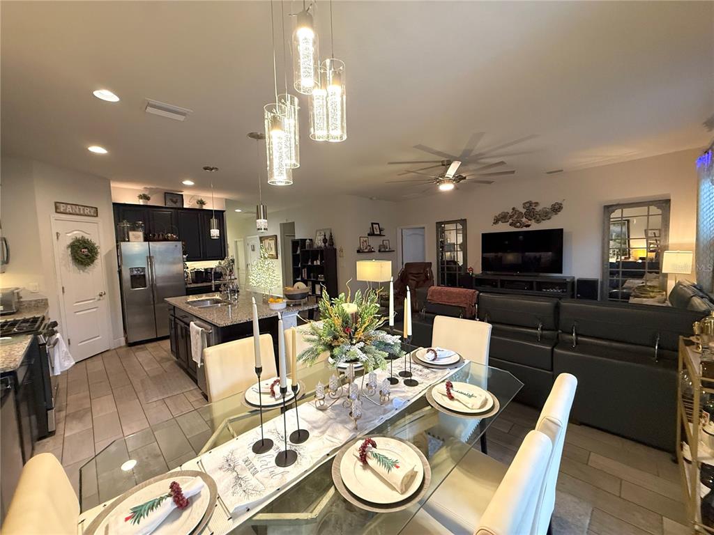 11104 Spring Point Circle Riverview, FL 33579 - Photo 20 of 52 a view of a dining room with furniture