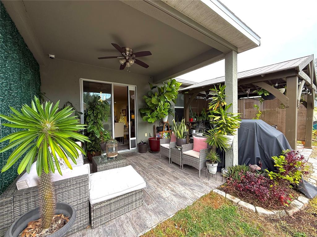 11104 Spring Point Circle Riverview, FL 33579 - Photo 27 of 52 a house with a potted plant in front of it