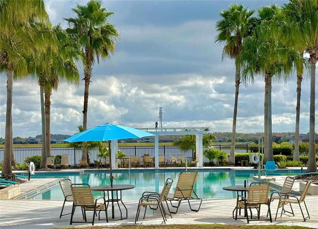 11104 Spring Point Circle Riverview, FL 33579 - Photo 39 of 52 an outdoor space with furniture and umbrella