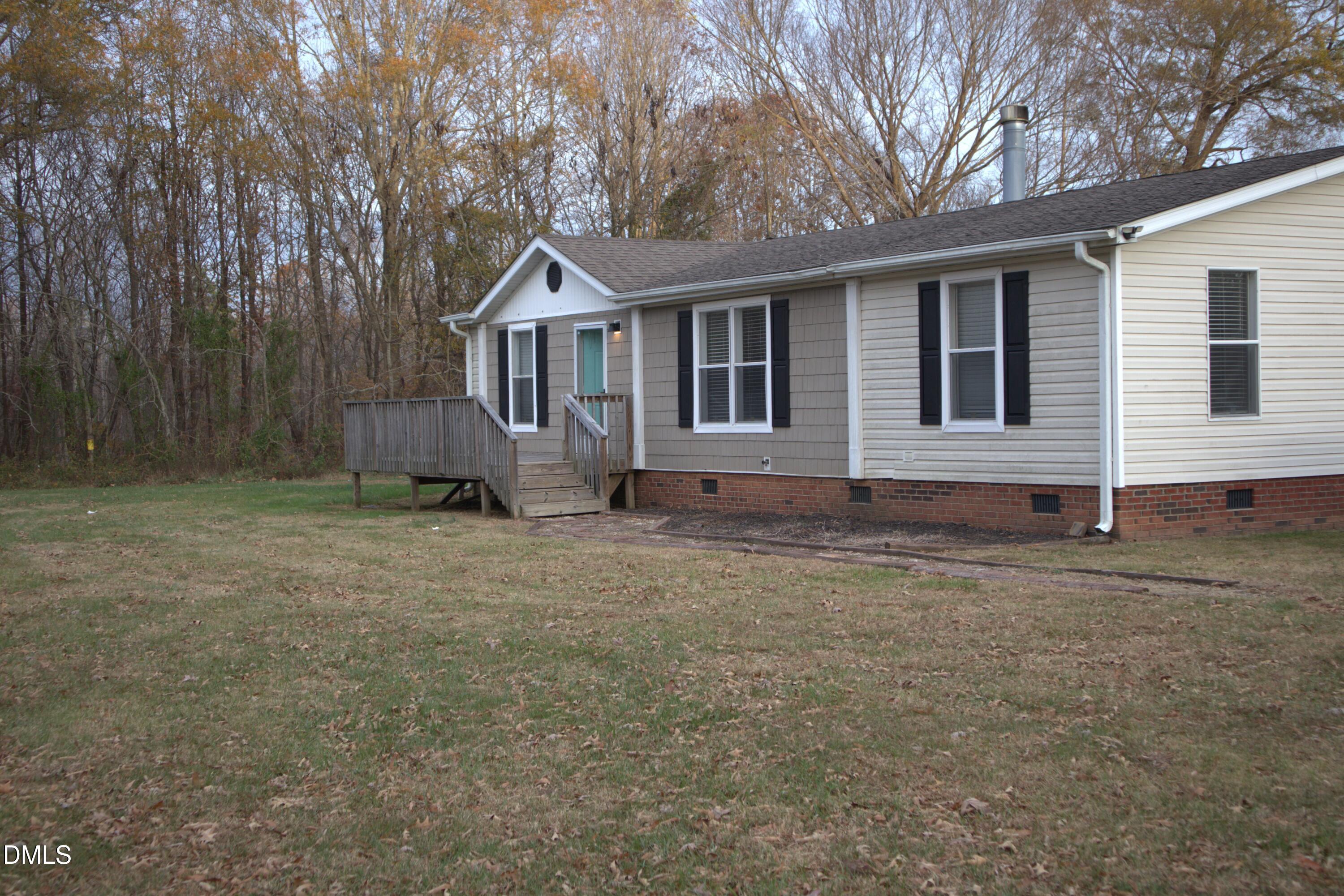 4762 Old Allensville Road Roxboro, NC 27574 - Photo 3 of 33 a front view of a house with a yard