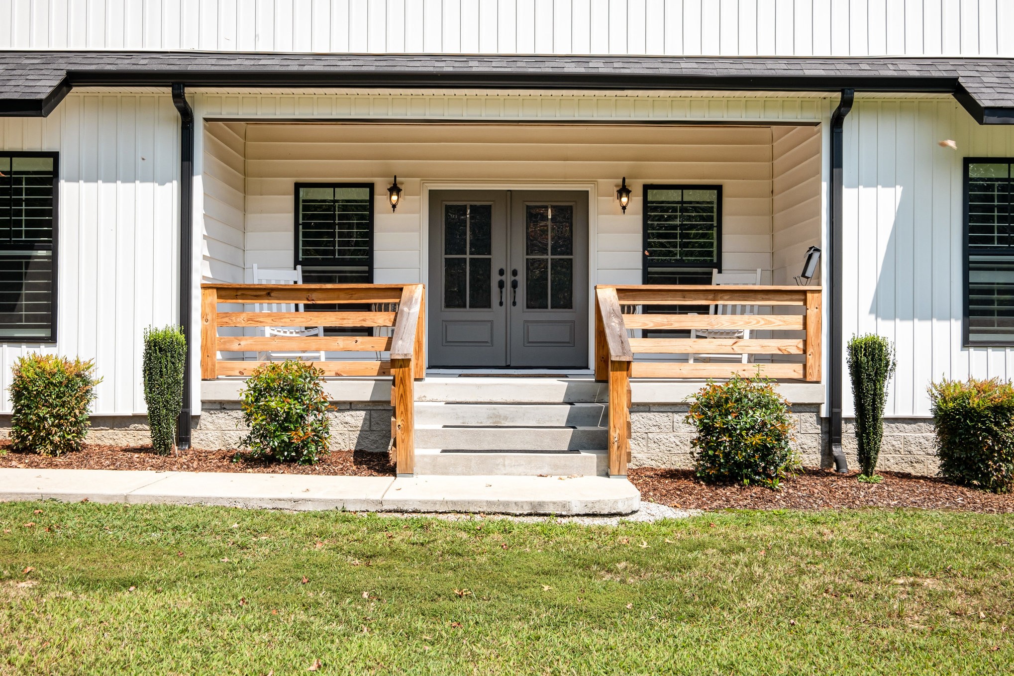 8129 Hollow Springs Road Bradyville, TN 37026 - Photo 18 of 42 a front view of a house with a yard